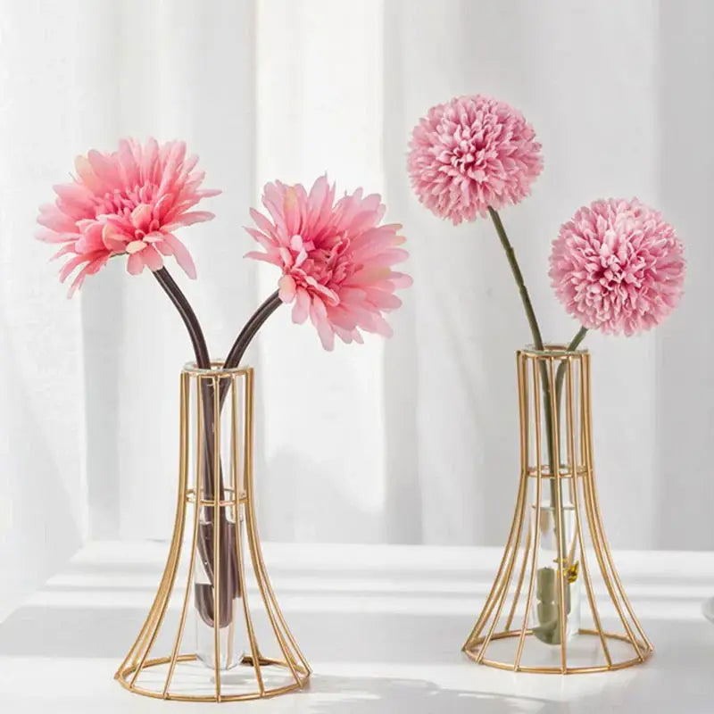 Gold vase with metal flowers featuring a gold wireframe and clear glass inserts for modern desk decoration