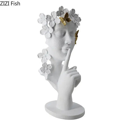 White resin sculpture of a woman with closed eyes adorned with white flowers and gold butterflies for living room decorbites gold silence garland figure