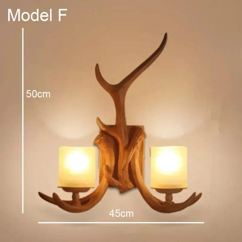 Golden antler deer horn wall lamp with two warm glass shades and rustic wooden finish for living room decorbites deer horn