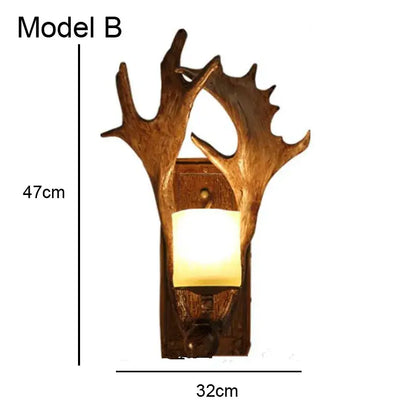 Golden antler deer horn wall lamp with warm glowing light in rustic wooden base for living room decorbites deer horn decor
