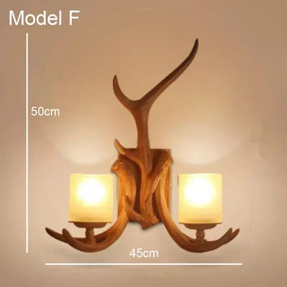 Golden antler deer horn wall lamp with two warm glass shades and rustic wooden finish decorbites deer horn decor