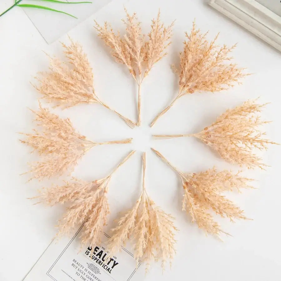 Beige dried pampas grass stems arranged in a circle in golden artificial autumn branches set for living room decorbites artificial autumn