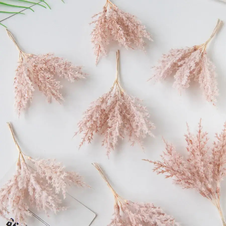 Delicate pink dried pampas grass bundles with feathery plumes and tan stems in decorbites artificial autumn branches set for living room decor