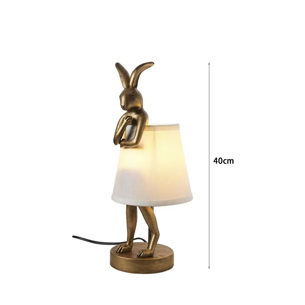 Golden bathing rabbit resin table lamp with white fabric shade for bedroom decor by Decorbites bathing rabbit