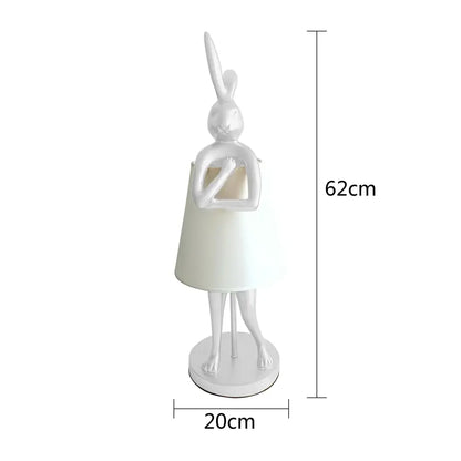 White ceramic bathing rabbit resin table lamp with cream conical shade and slender legs for decorbites bedroom decor