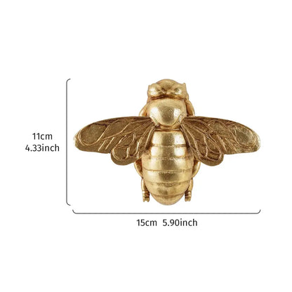 Golden bee resin wall hanger with metallic detailed wings and segmented body for living room decorbites golden bee decor