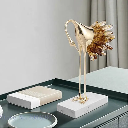 Golden bird agate marble crane statue with crystal feather detail on white marble base for living room home decor