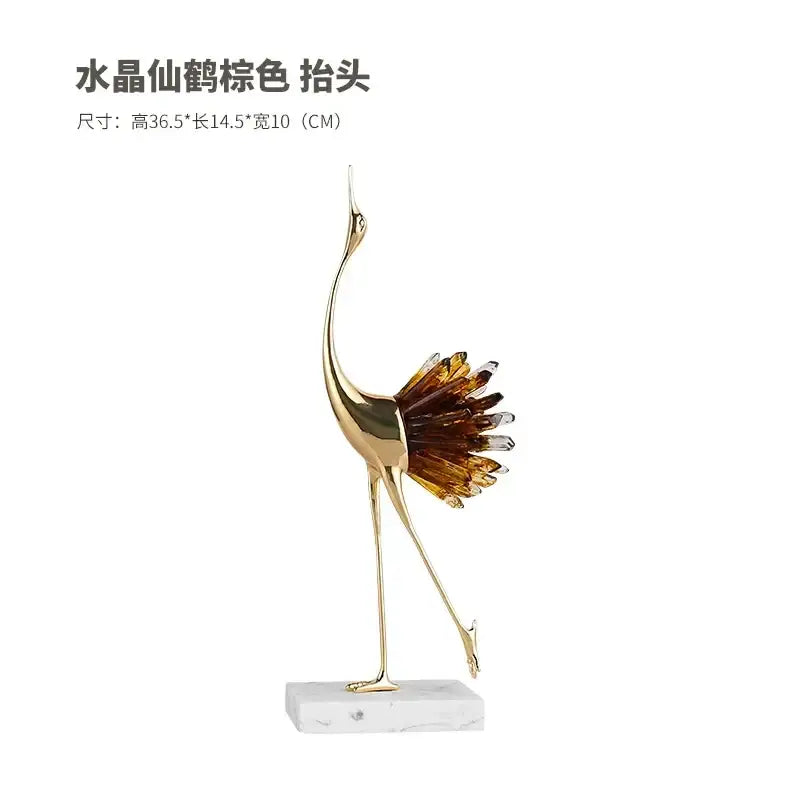 Golden bird agate marble crane statue with amber and clear crystal feathers on white marble base for home decor