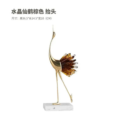 Golden bird agate marble crane statue with amber and clear crystal feathers on white marble base for home decor