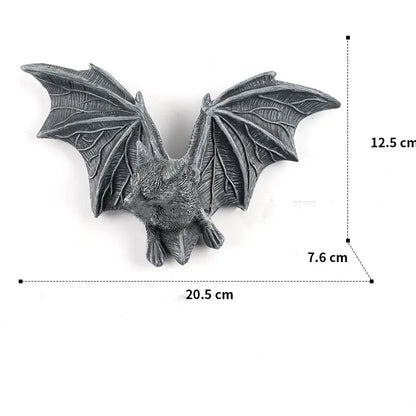 Gray intricately detailed bat figurine with spread wings in decorbites golden bird and butterfly resin wall decor for living room