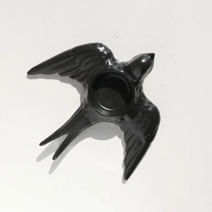 Black ceramic swallow-shaped candle holder tray with glossy finish and circular opening for wedding decor