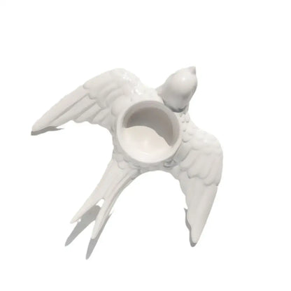 White ceramic bird-shaped candle holder tray with detailed wings and tail feathers for wedding dining room decor