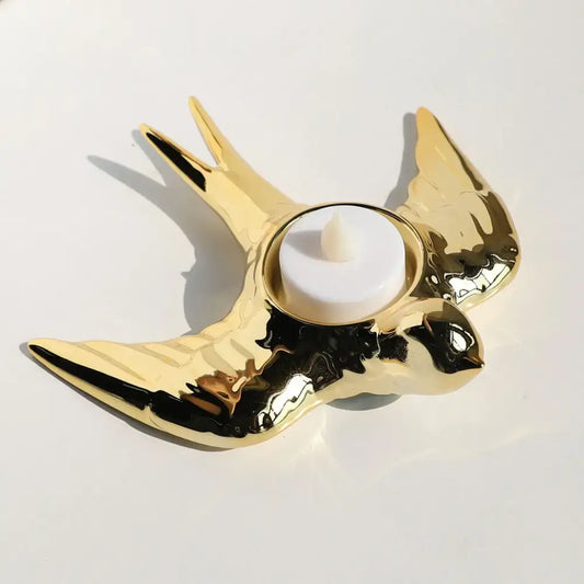 Golden swallow-shaped ceramic candle holder tray with glossy finish and black accents for led tea light decor