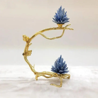 Golden bird metal branch sculpture with a golden stand holding two vibrant blue crystal clusters for living room decor