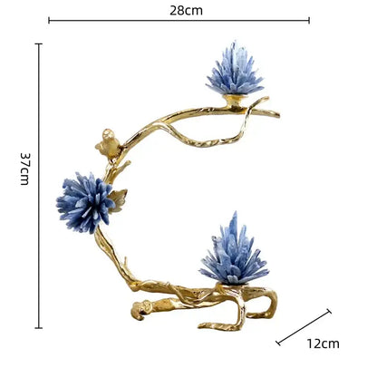 Golden bird metal branch sculpture featuring crystal blue flowers and small bird figures for living room decor