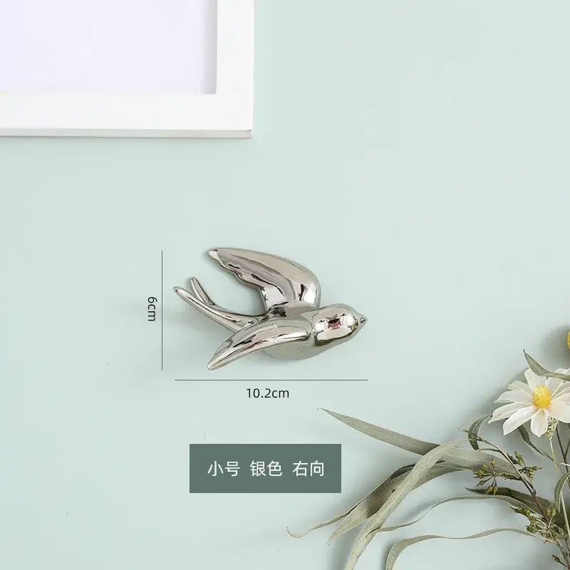 Silver swallow bird sculpture 6cm tall sleek metallic finish right-facing wall decorbites golden bird decor