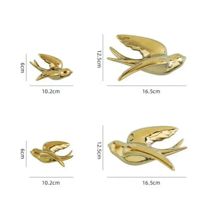 Decorbites golden bird swallow sculpture with smooth glossy gold surfaces and detailed wings for living room decor