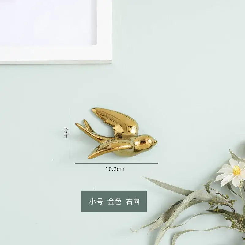 Golden bird swallow sculpture decorbites wall decor with sleek metallic finish 6cm tall and 10.2cm wide