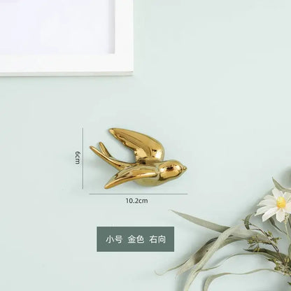 Golden bird swallow sculpture decorbites wall decor with sleek metallic finish 6cm tall and 10.2cm wide
