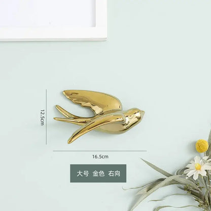 Golden bird swallow glossy ceramic wall decor with sleek wings and streamlined body for living room decorbites golden bird