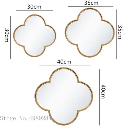 Three gold-toned geometric plum flower wall mirrors with golden border in 30cm to 40cm sizes for living room decor