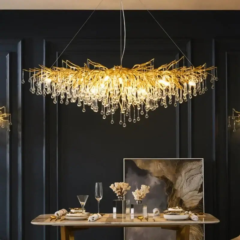 Golden branch crystal chandelier with dangling crystal droplets in gold for luxurious living room lighting