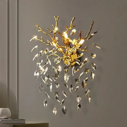 Golden branch crystal wall lamp with dangling crystal leaves in gold for elegant living room decorbites crystal wall sconce