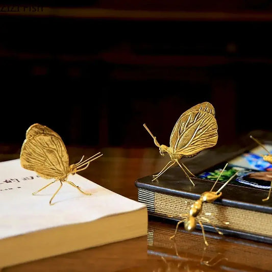 Golden butterfly ant miniature metal figurine with intricate wing patterns for elegant living room decor