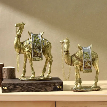 Decorbites golden camel resin sculpture set featuring golden camel figurines with intricate metallic saddles and chains
