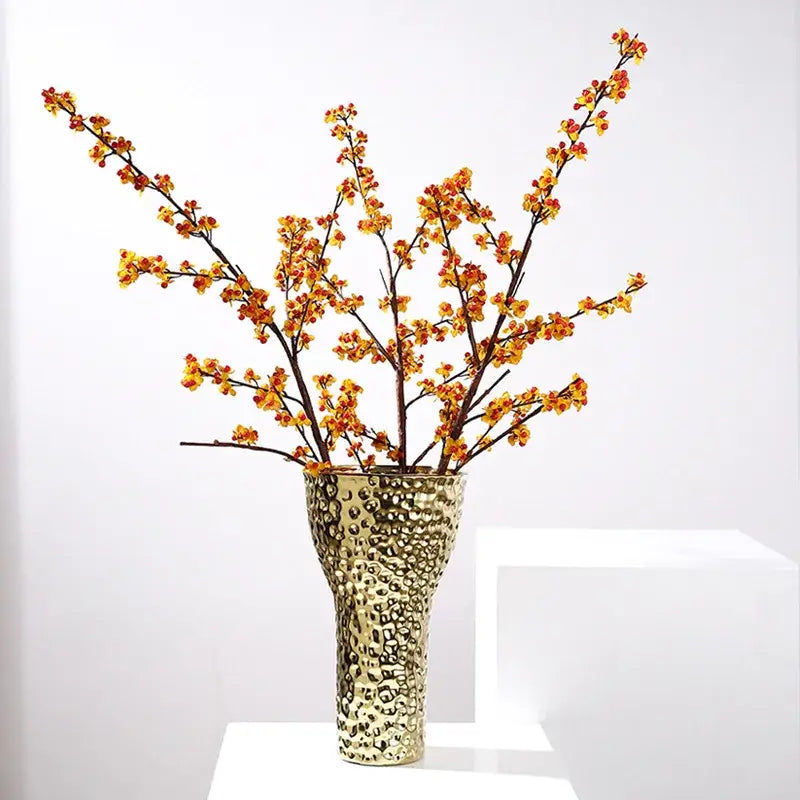 Gold-toned geometric honeycomb vase with textured hammered surface and slender silhouette for living room decorbites golden ceramic decor