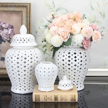 White ceramic ginger jars with intricate diamond cutouts and lids in varying sizes for home decor by decorbites golden ceramic