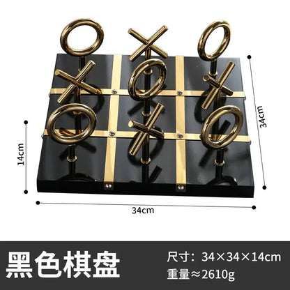 Black glossy tic-tac-toe board with gold metal xs and os in decorbites golden chessboard metal handicraft design