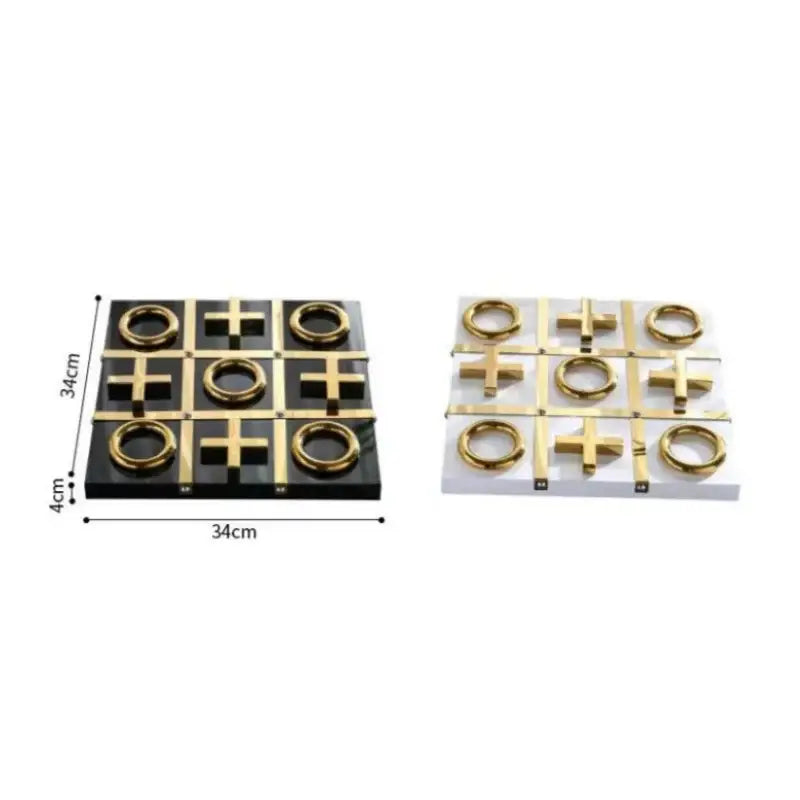 Black and white tic tac toe game boards with gold-colored xs and os in decorbites golden chessboard metal handicraft set