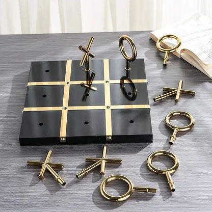 Black and gold tic-tac-toe game set with metallic crosses and circles from decorbites golden chessboard metal handicraft collection