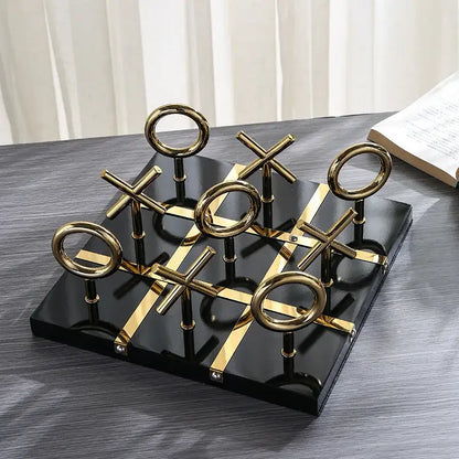 Decorbites golden chessboard metal handicraft tic-tac-toe set with gold circular and cross pieces on black base for living room decor
