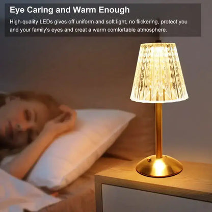 Gold-toned crystal diamond touch sensor table lamp with pleated translucent glass shade emitting warm light for bedroom