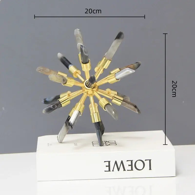 Golden crystal metal sea urchin figurine with translucent crystal arms and black tips on white base for living room decorbites decor