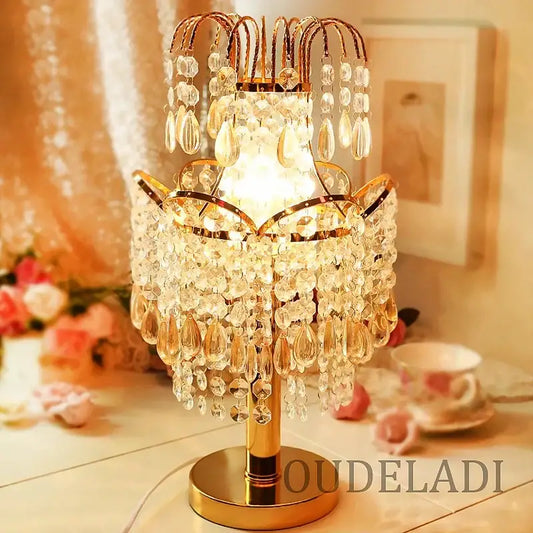Golden crystal table lamp with cascading teardrop and faceted crystals for bedroom decor by decorbites crystal table