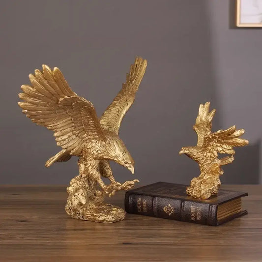 Golden dapeng eagle wings resin statue with detailed feather texture in dynamic pose on rocky base for office decor