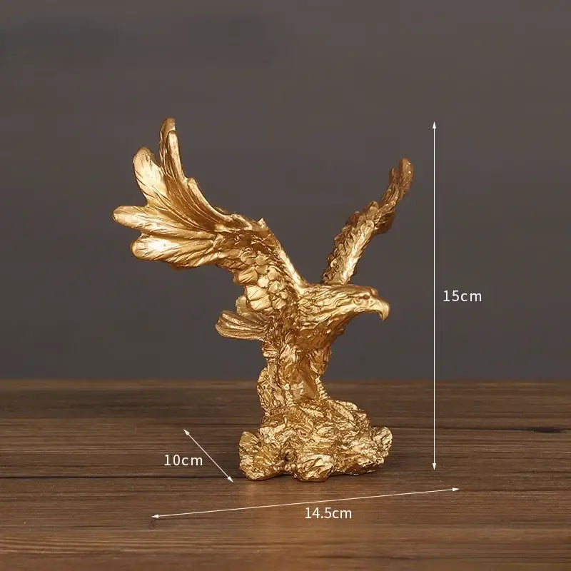 Golden dapeng eagle wings resin statue with detailed textured wings and rocky base for office decor by decorbites