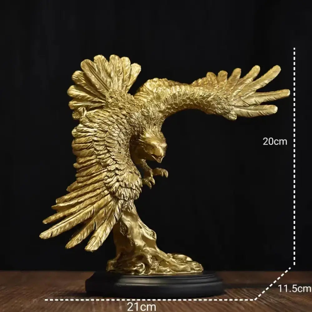 Golden dapeng eagle wings resin statue with detailed feathering on a dark base for office decor by Decorbites