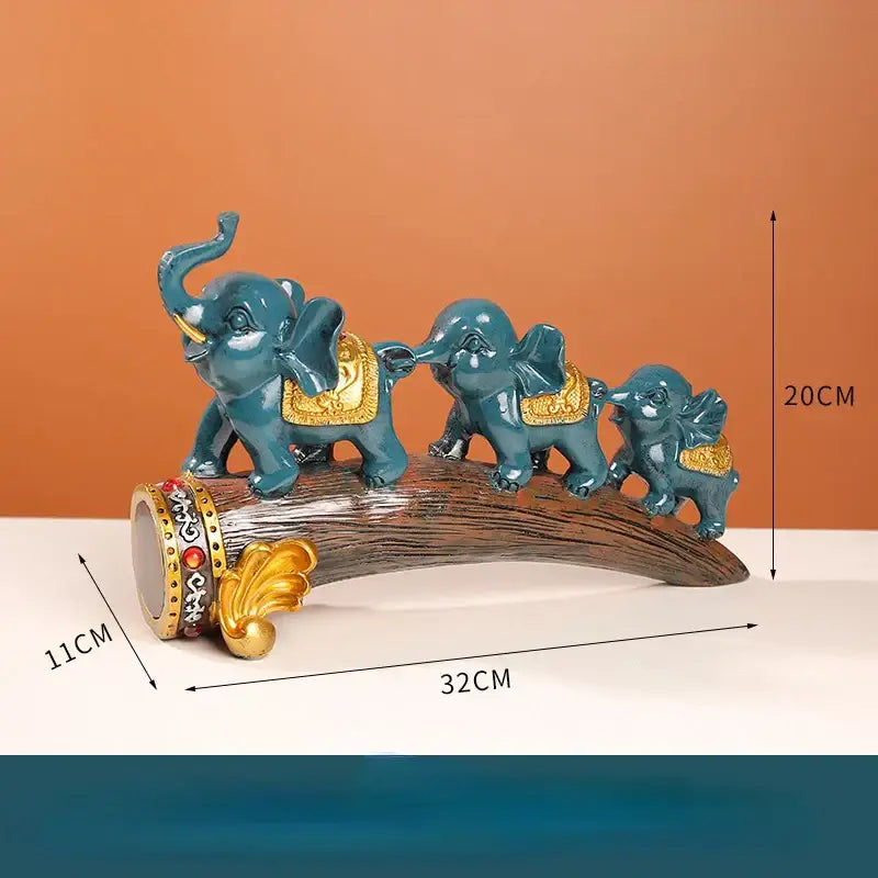 Teal elephant resin ornament set with gold accents on wooden log base by decorbites for living room decor