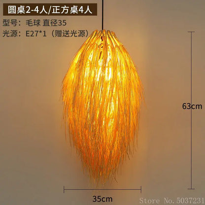 Warmly glowing golden feathery bamboo weave pendant lamp crafted from natural bamboo fibers for bedroom lighting