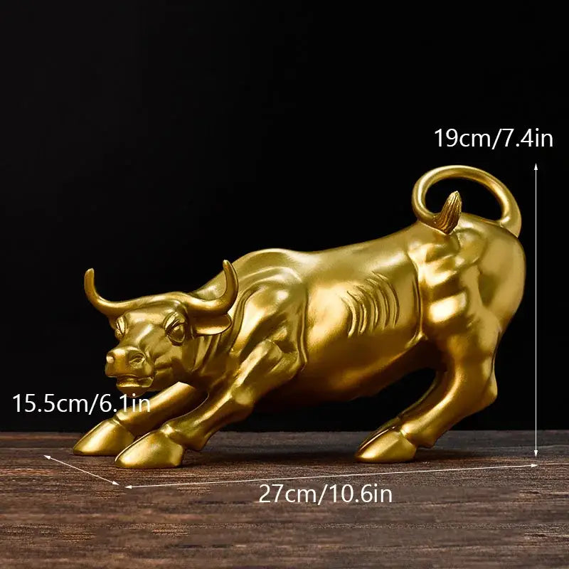 Golden metallic fortune resin sculpture of a dynamic charging bull with detailed musculature for office desk decor