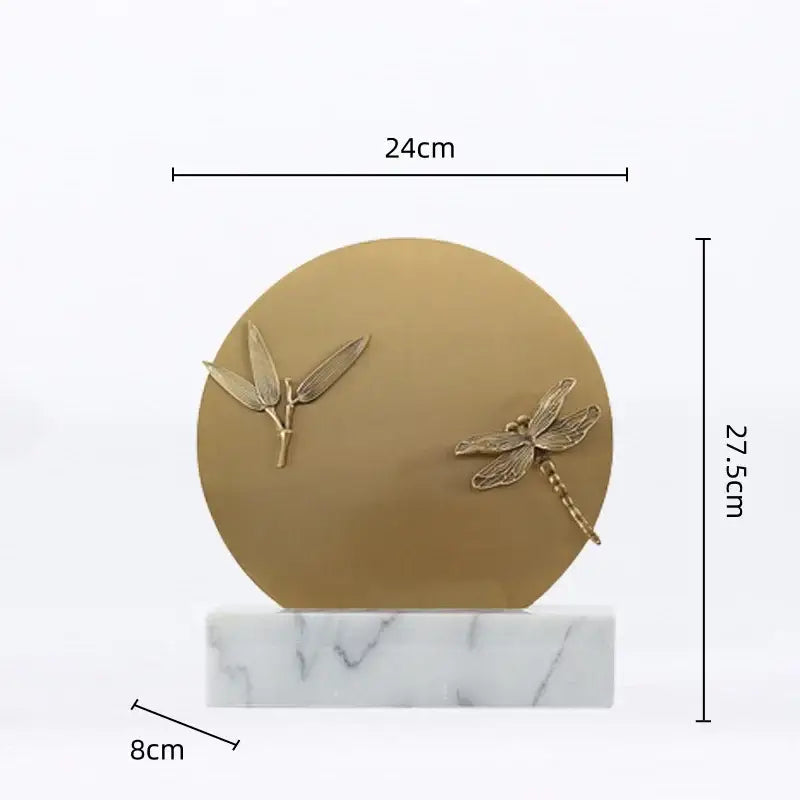 Gold-toned dragonfly and bamboo leaf figurine set on white marble base for home decor by decorbites golden geometric