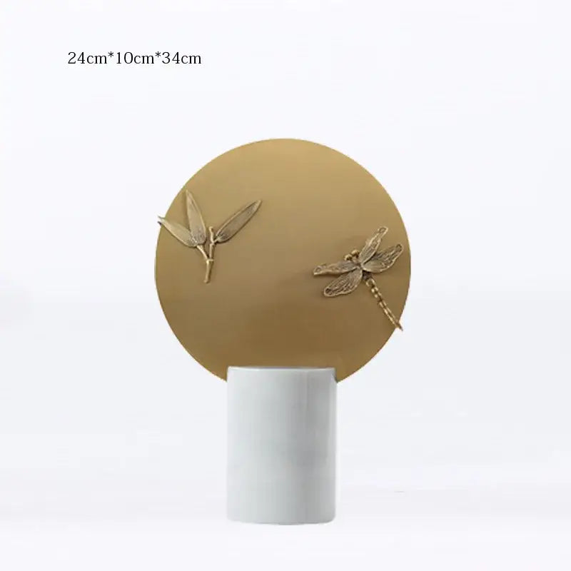 Gold-toned dragonfly and leaf figurine set on a matte white base for home decor by decorbites golden geometric