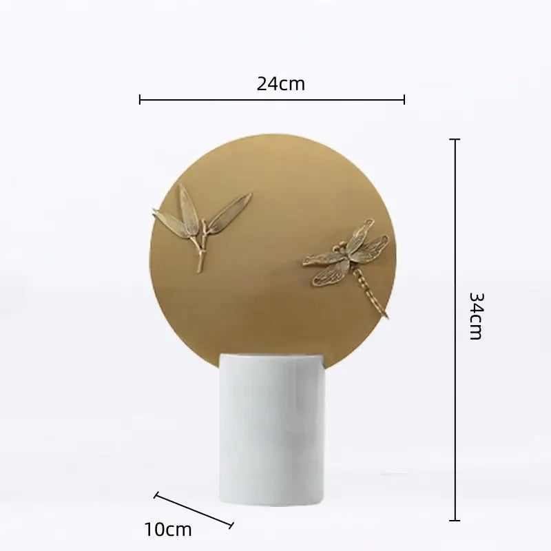 A decorbites golden geometric figurine set features a matte gold insect sculpture on a white ceramic base for home decor