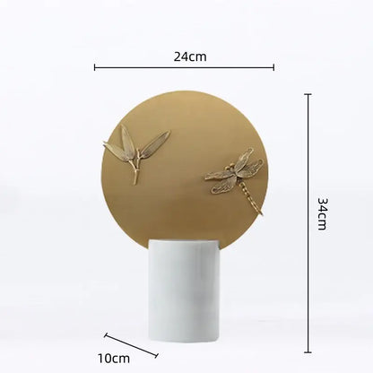 A decorbites golden geometric figurine set features a matte gold insect sculpture on a white ceramic base for home decor