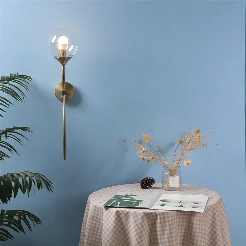 Brass sconce with clear glass globe housing bulb golden glass ball led wall light by decorbites for bedroom decor