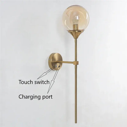 Brass-finished wall sconce with golden glass ball led amber bulb and elongated stem for decorbites golden glass lighting